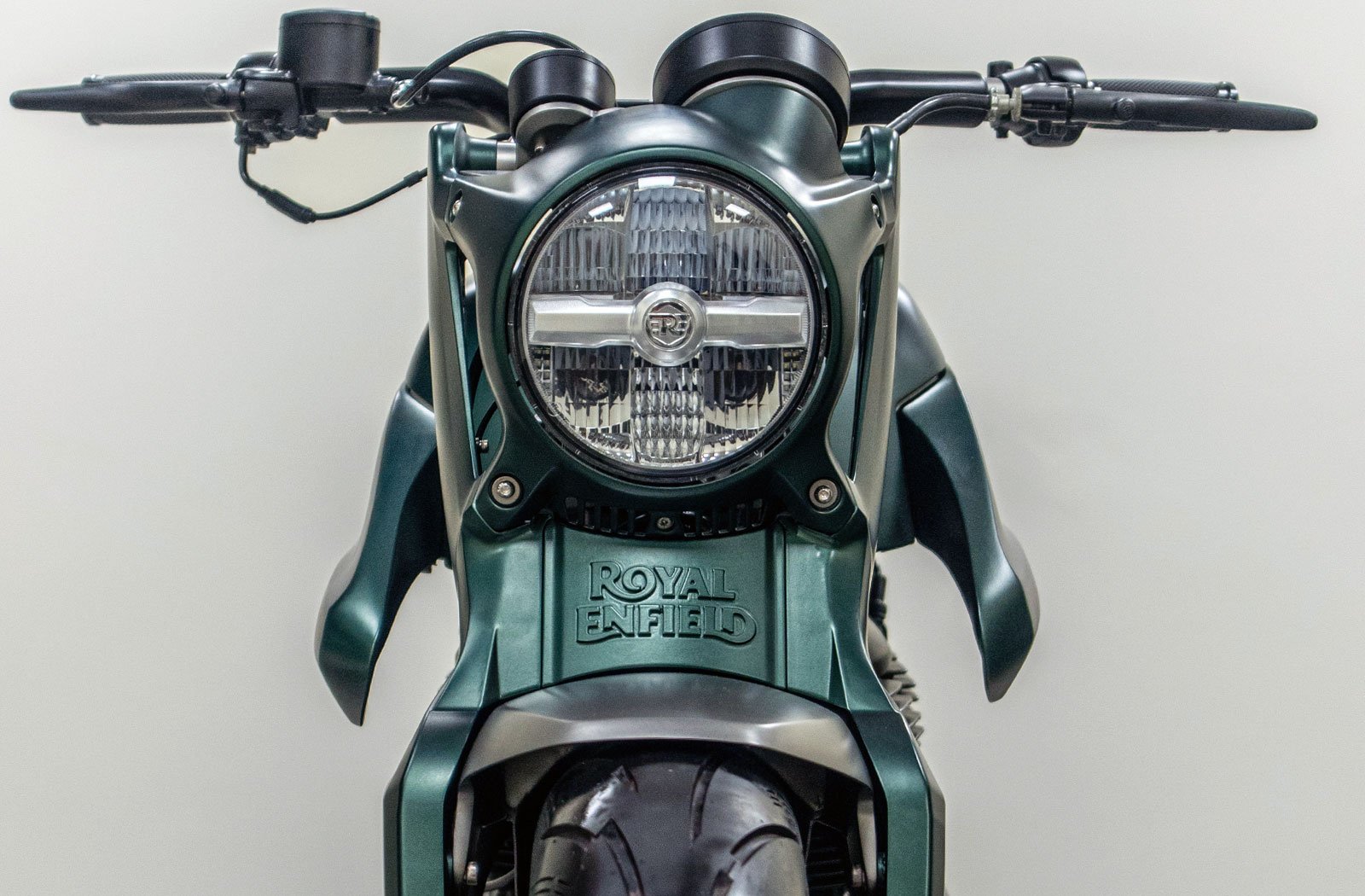 front photograph of a custom Royal Enfield Shotgun 650 motorcycle with LED headlight and Royal Enfield logo